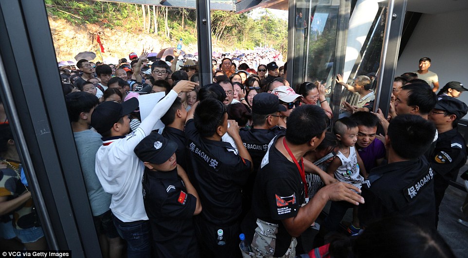 Nobody can stop me! Visitors crowded at the entrance of the glass-bottom bridge at Zhangjiajie Grand Canyon on August 20